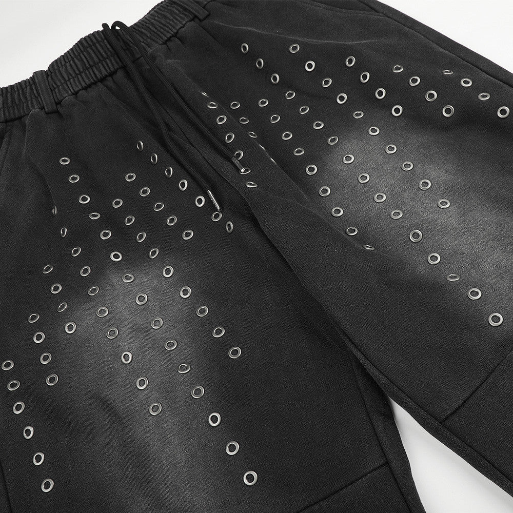 Pantalon de survêtement ample à œillets métalliques, finition délavée à l’acide & ourlet brut
