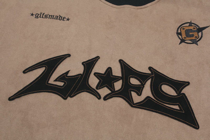 Langarmshirt aus velourslederartigem Material im Colorblock-Design mit Graffiti-Patch-Logo