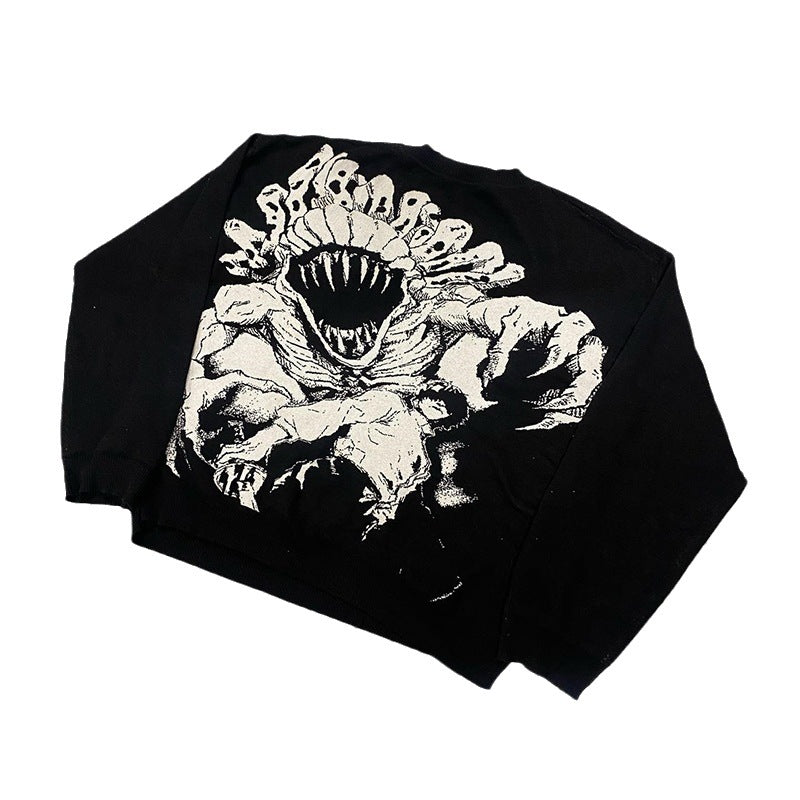 The Jujutsu Kaisen Premium Yuta Okkotsu-Inspired Full Knit Sweater features a striking jacquard design of a monstrous creature with an open mouth, teeth, and claws. Its black color emphasizes the bold white graphic, making it a standout piece in streetwear fashion.