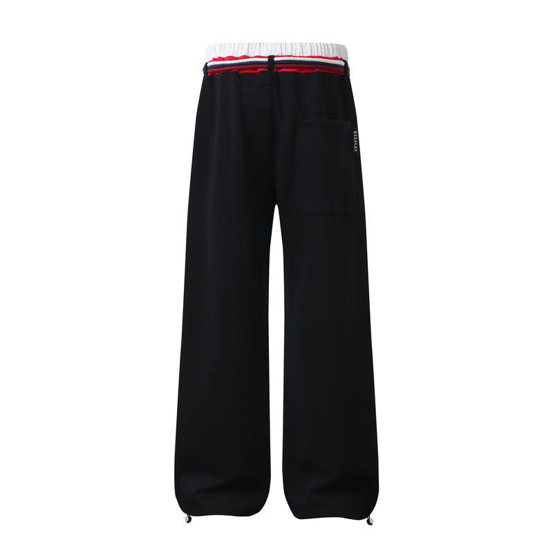 Pantalon de survêtement à jambes larges avec double ceinture et cordon tressé