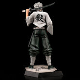 The Shinjuro Rengoku Demon Slayer PVC Figure stands facing away, sword over right shoulder, with spiky gray hair, a white shirt displaying a black kanji symbol, dark pants, and bandaged legs on a hexagonal base.