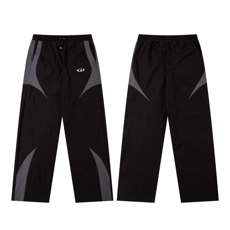 Herren-Trackpants mit kontrastierender Paspel und Colorblock-Seiteneinsätzen
