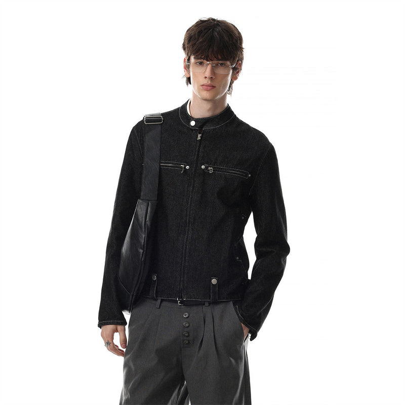 Model wearing black zip-up denim moto jacket with stand collar and cropped fit