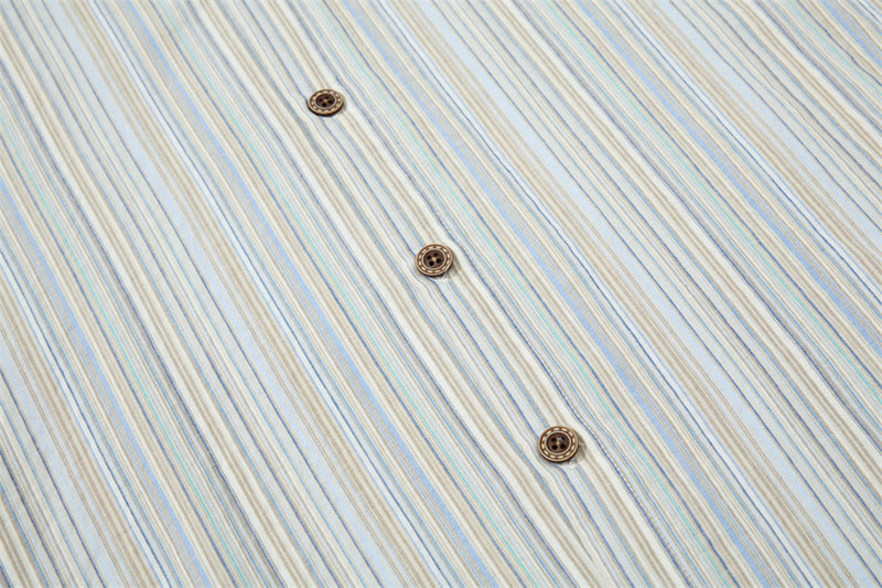 Close-up of striped shirt front with three brown buttons