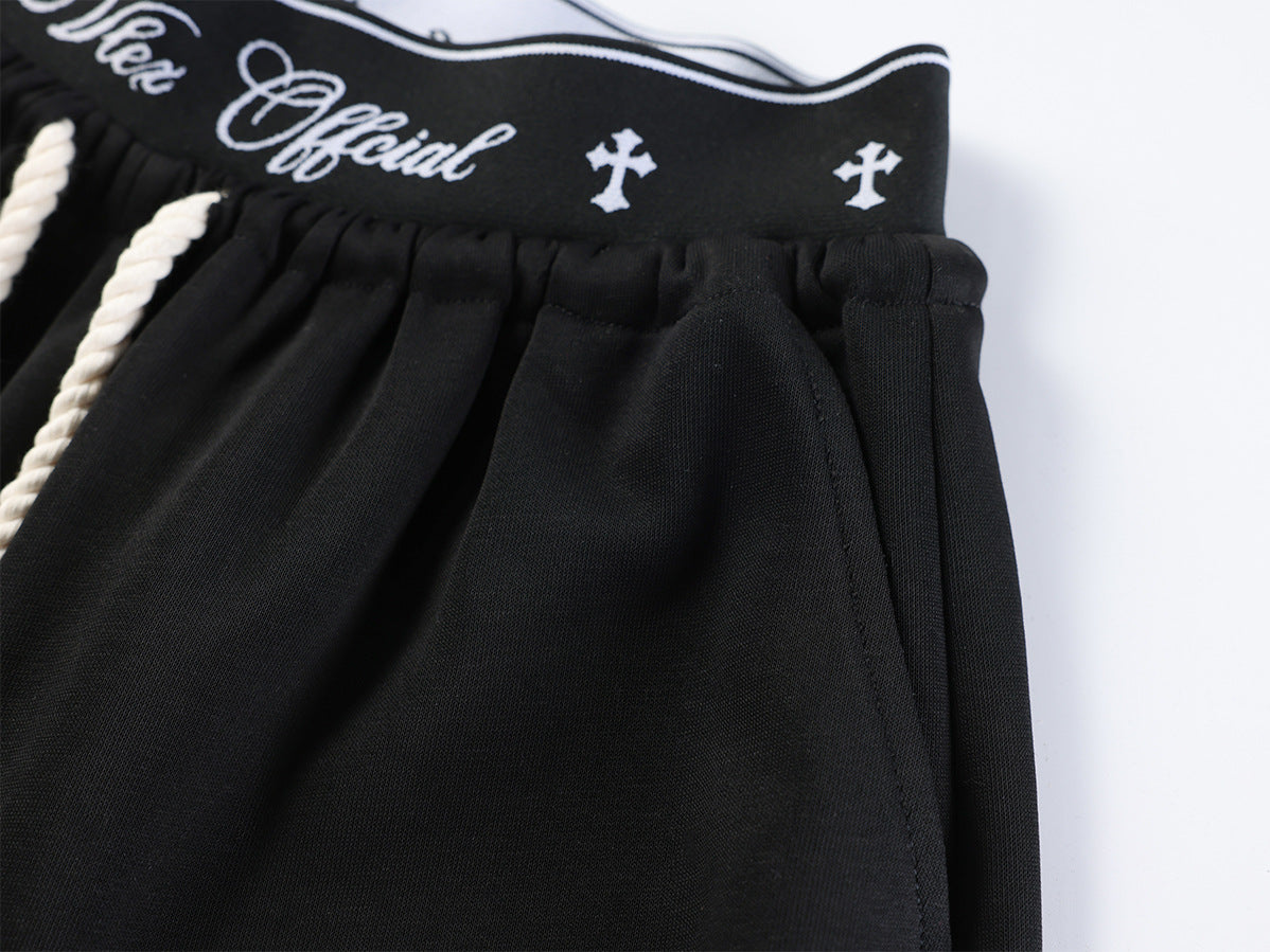 Pantalon de survêtement à jambes larges avec imprimé graffiti cursif et ceinture élastiquée siglée