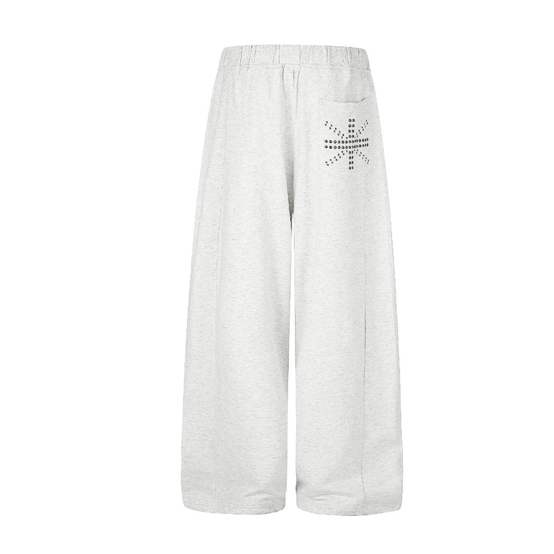 Jogging à jambes larges avec clous – Coupe ample et croix ornée de strass