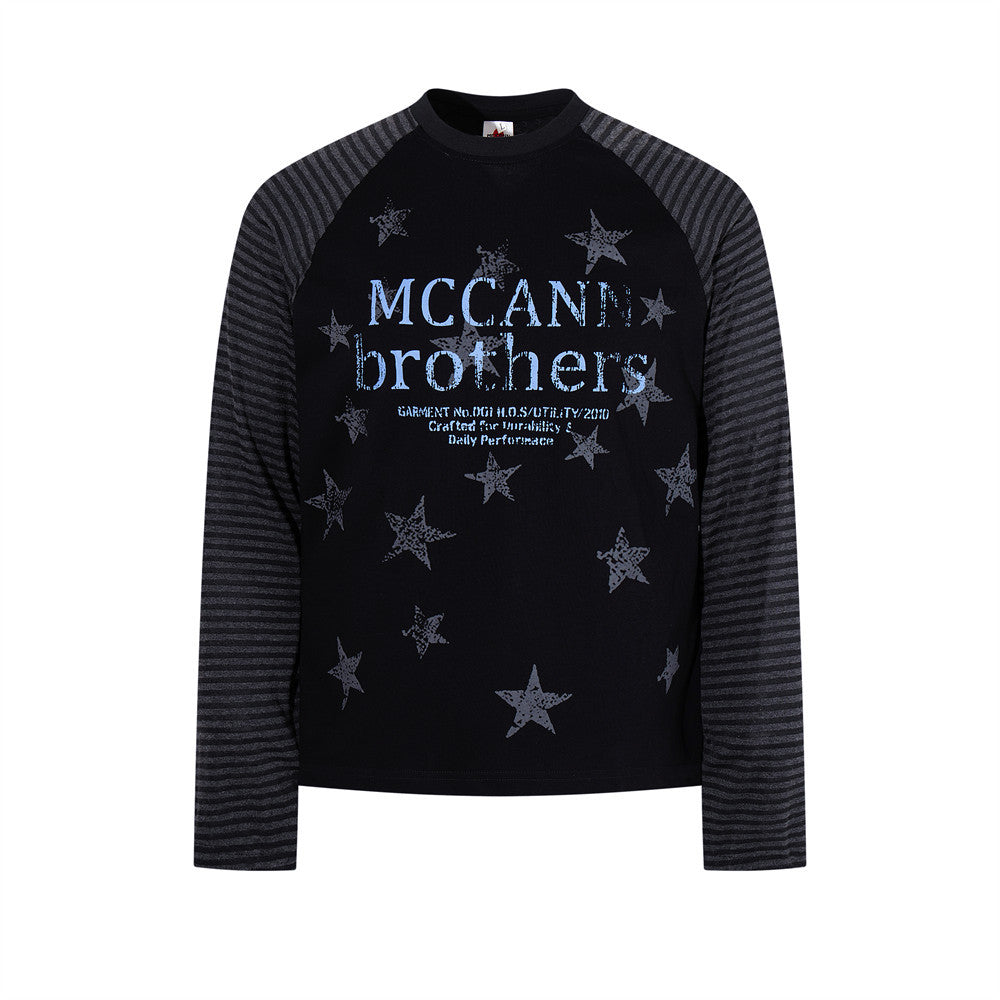 Men's black long sleeve raglan shirt with all-over distressed star print and dark grey horizontal striped sleeves, MCCANN Bro