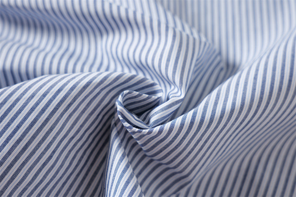 Close-up of blue and white striped fabric gathered in folds
