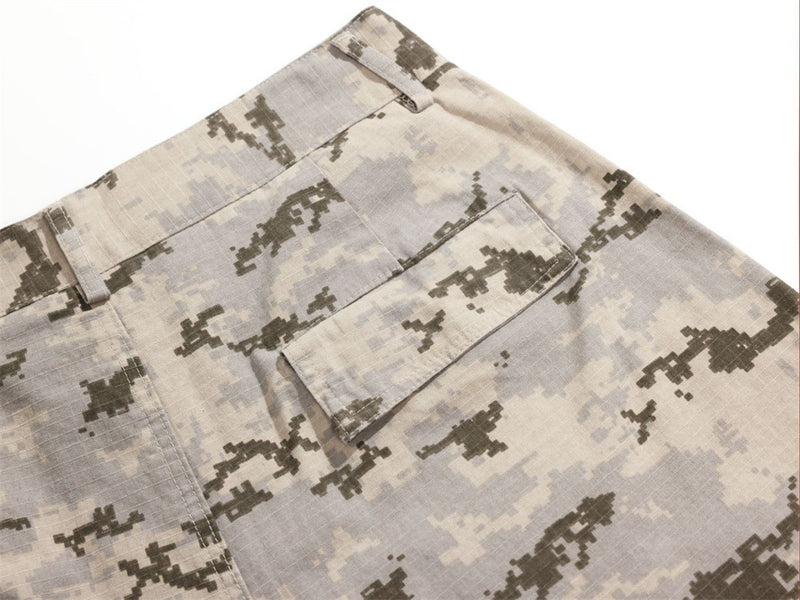 Close-up of rear cargo pocket flap on desert camo trousers