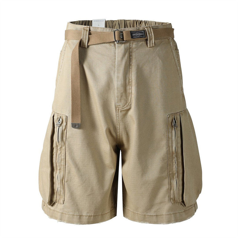 Front view of khaki cargo shorts with belt and large zip side pockets
