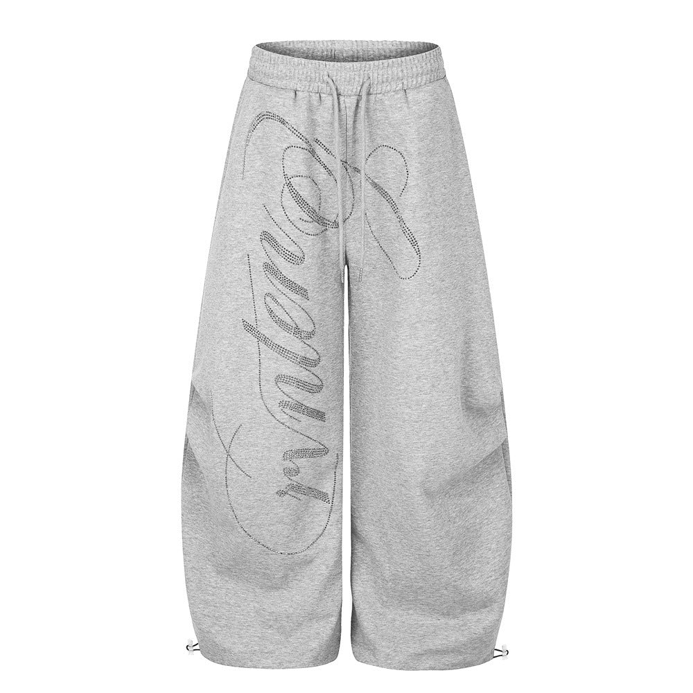 Pantalones de Chándal de Pierna Ancha con Texto de Strass – Corte Bombacho Extragrande con Cordón