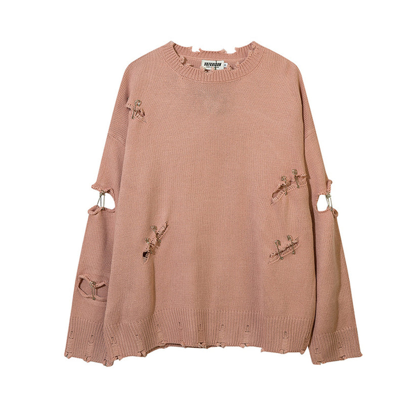 Oversized distressed crewneck knit sweater with safety pin details in dusty pink and black colorways