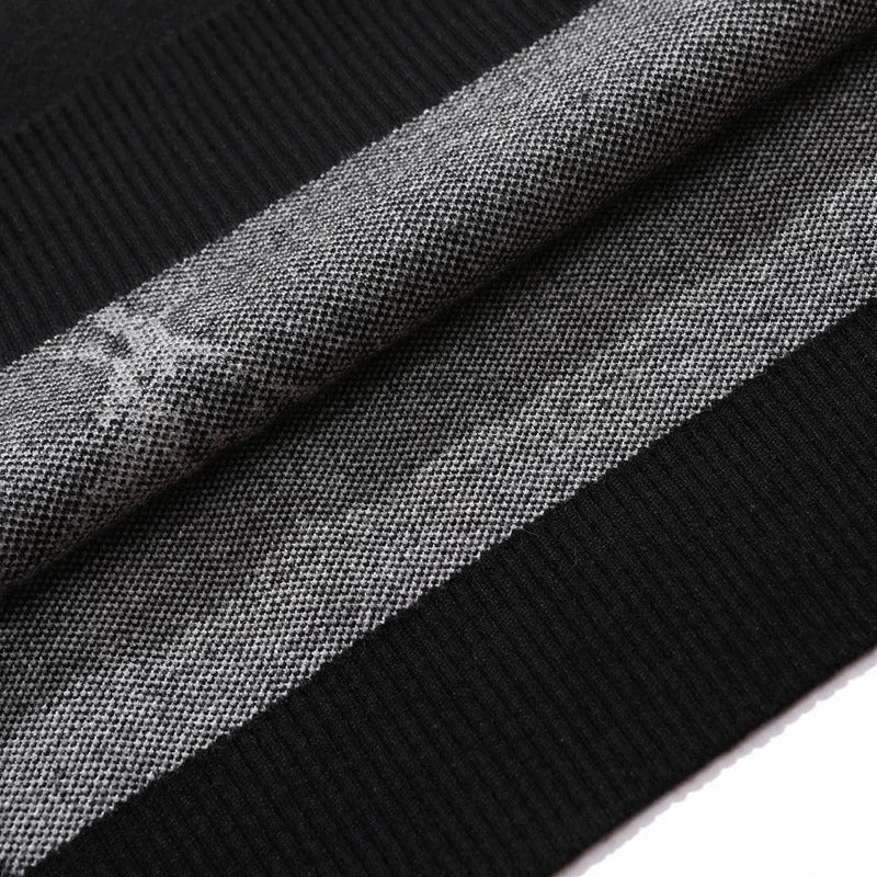 Close-up of a textured fabric featuring monochrome houndstooth and a black border, ideal for crafting gothic streetwear. This Death Note Premium Knit Sweater—Misa Amane Jacquard Design exudes the perfect Death Note sweater vibe.