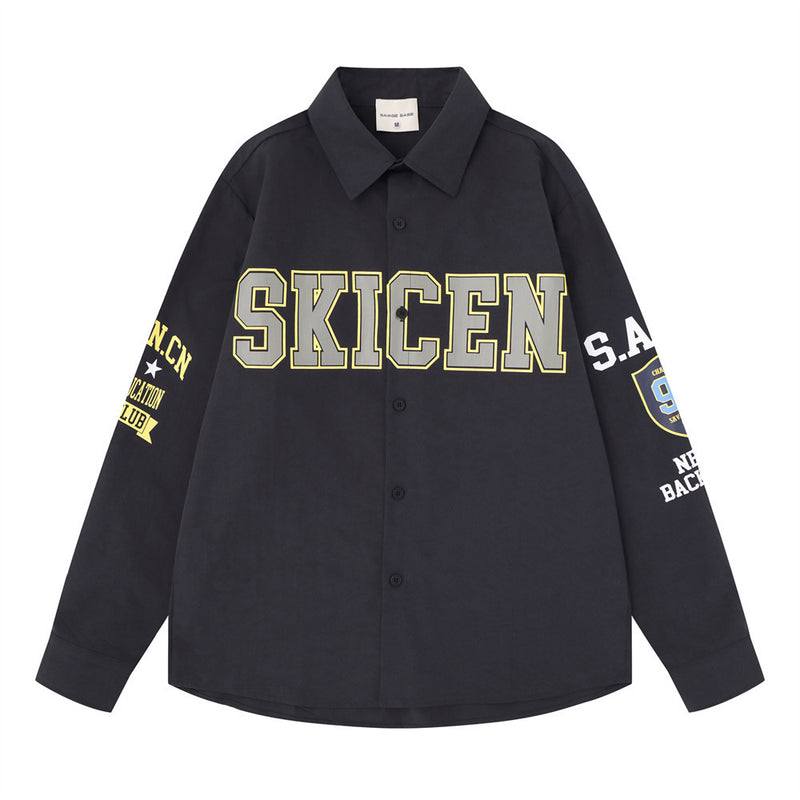 Oversized long sleeve button-up shirt with varsity SKICEN letter print on chest and sleeve graphics, shown in dark navy and w
