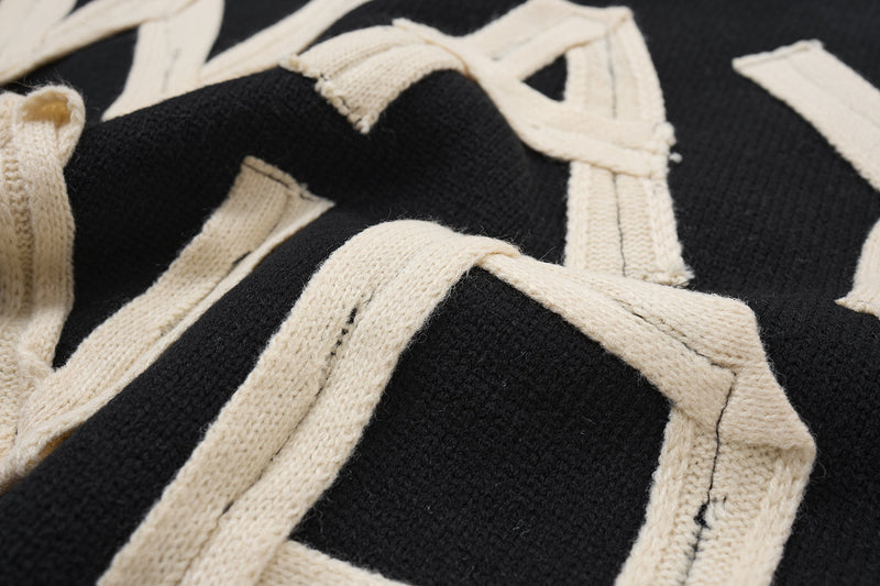 Pull col rond oversize en maille usée avec motif de lettres appliquées