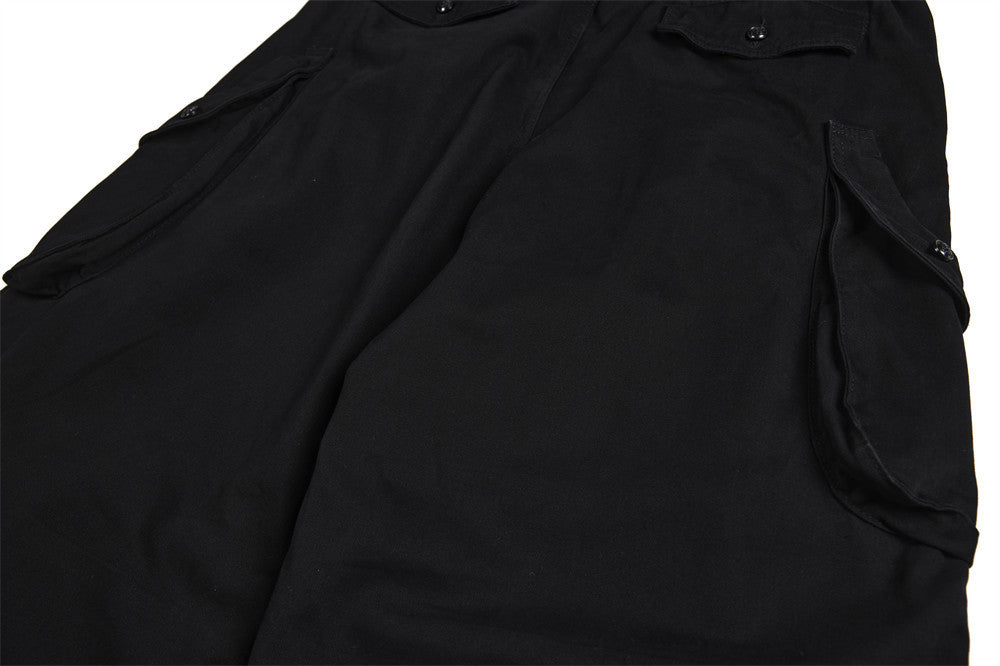 Pantalon cargo homme noir wide leg avec taille effet double boutonnage et multiples poches