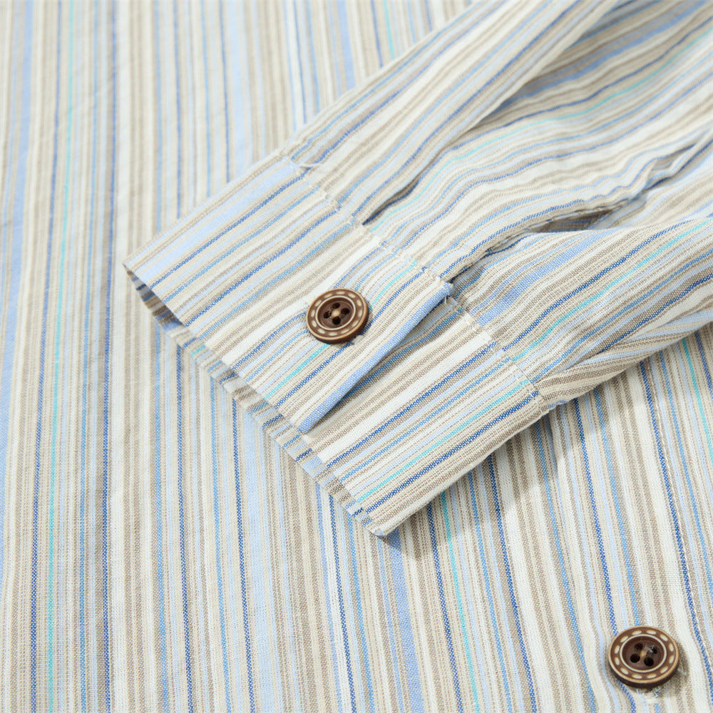 Close-up of striped sleeve cuff with button detail