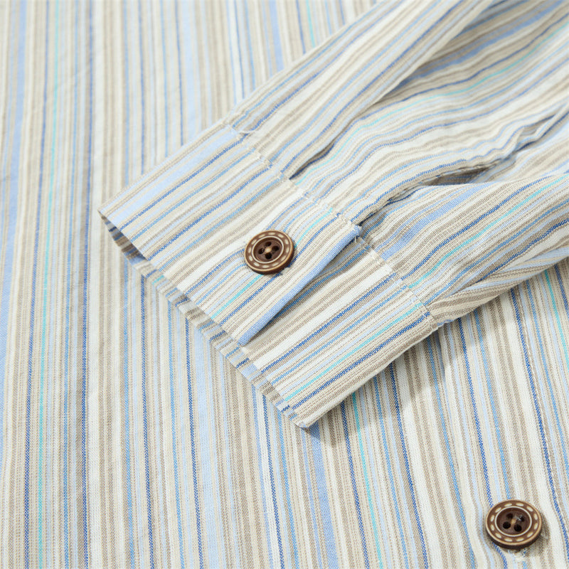 Close-up of striped sleeve cuff with button detail