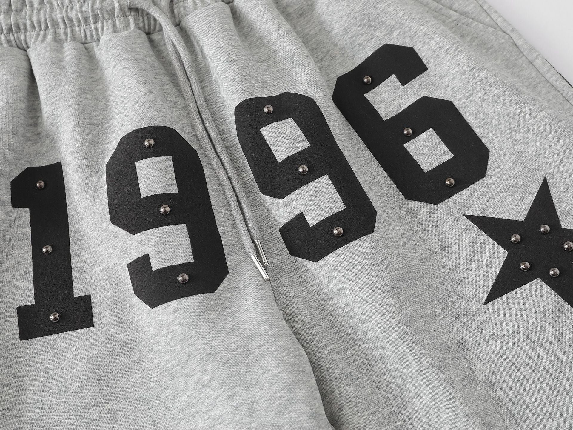 Pantalon de survêtement à jambes larges clouté d’étoiles 1996 avec détail à trois bandes