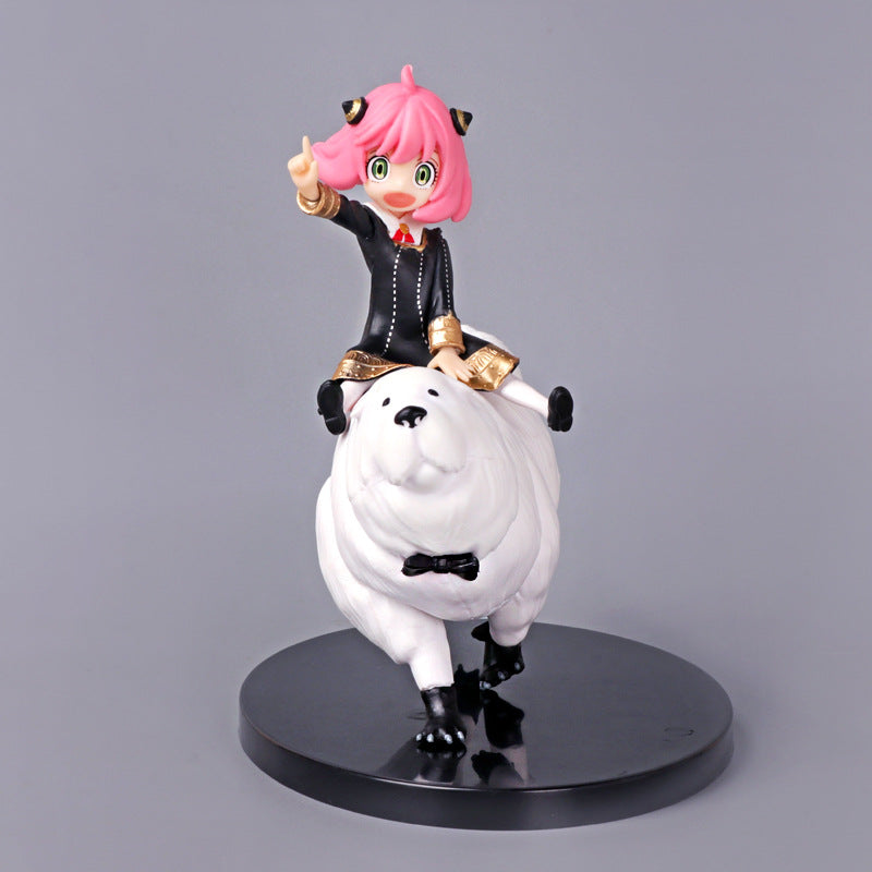 Anya Forger from Spy x Family, with her signature pink hair, is shown in black attire riding a white fluffy polar bear sporting a black bow tie. This collectible statue stands on a sleek black circular base and measures 17 cm.