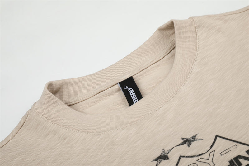 Close-up of beige crew neck collar and inner label on long sleeve tee
