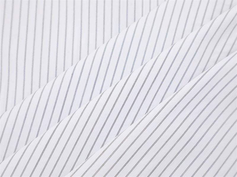 Close-up of layered white fabric with fine vertical pinstripes