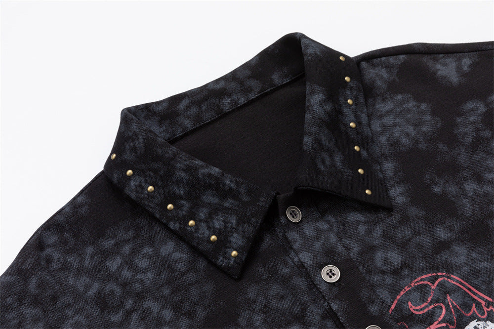 Close-up of the mottled polo collar with small gold-tone studs and visible black button placket