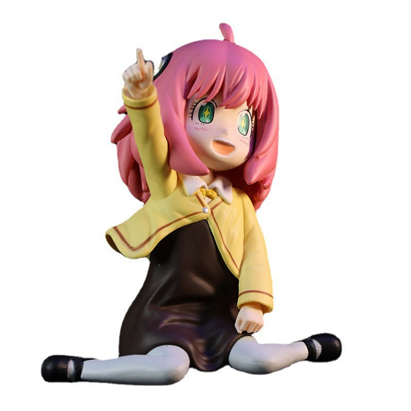 This Anya Forger in Yellow School Uniform figure from Spy × Family features the iconic character with pink hair, green eyes, and a brown dress. Sitting cross-legged and joyfully raising a finger, this interchangeable face PVC anime figure is essential for any fan&