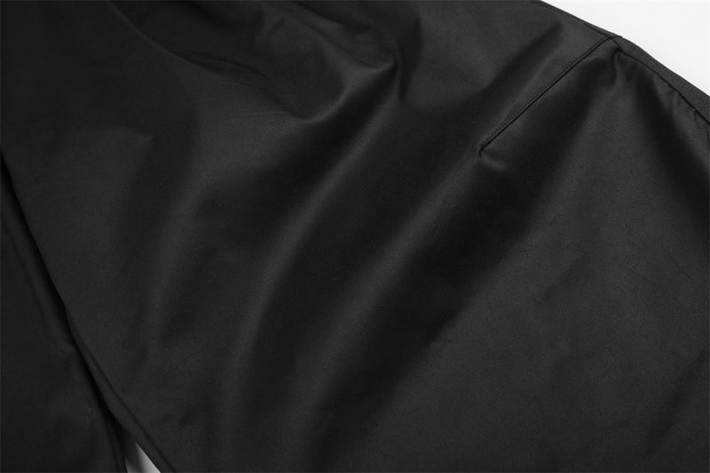 Wide-Leg Pleated Trousers – Oversized Silhouette with Curved Hem
