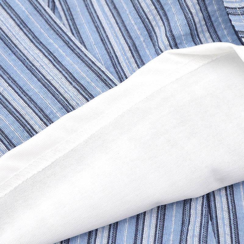 Blue striped shirt fabric close-up with white inner layer