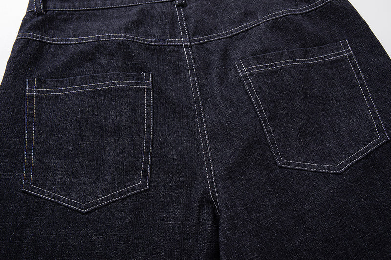 Vaqueros baggy de pierna ancha, lavado oscuro, bragueta diagonal de botones y denim crudo