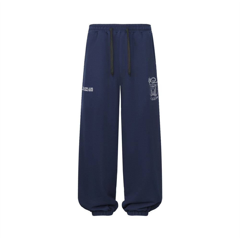 Pantalon de survêtement homme à jambes larges avec écusson brodé et imprimé graphique en écriture