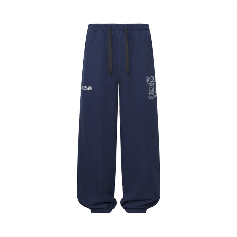 Pantalon de survêtement homme à jambes larges avec écusson brodé et imprimé graphique en écriture