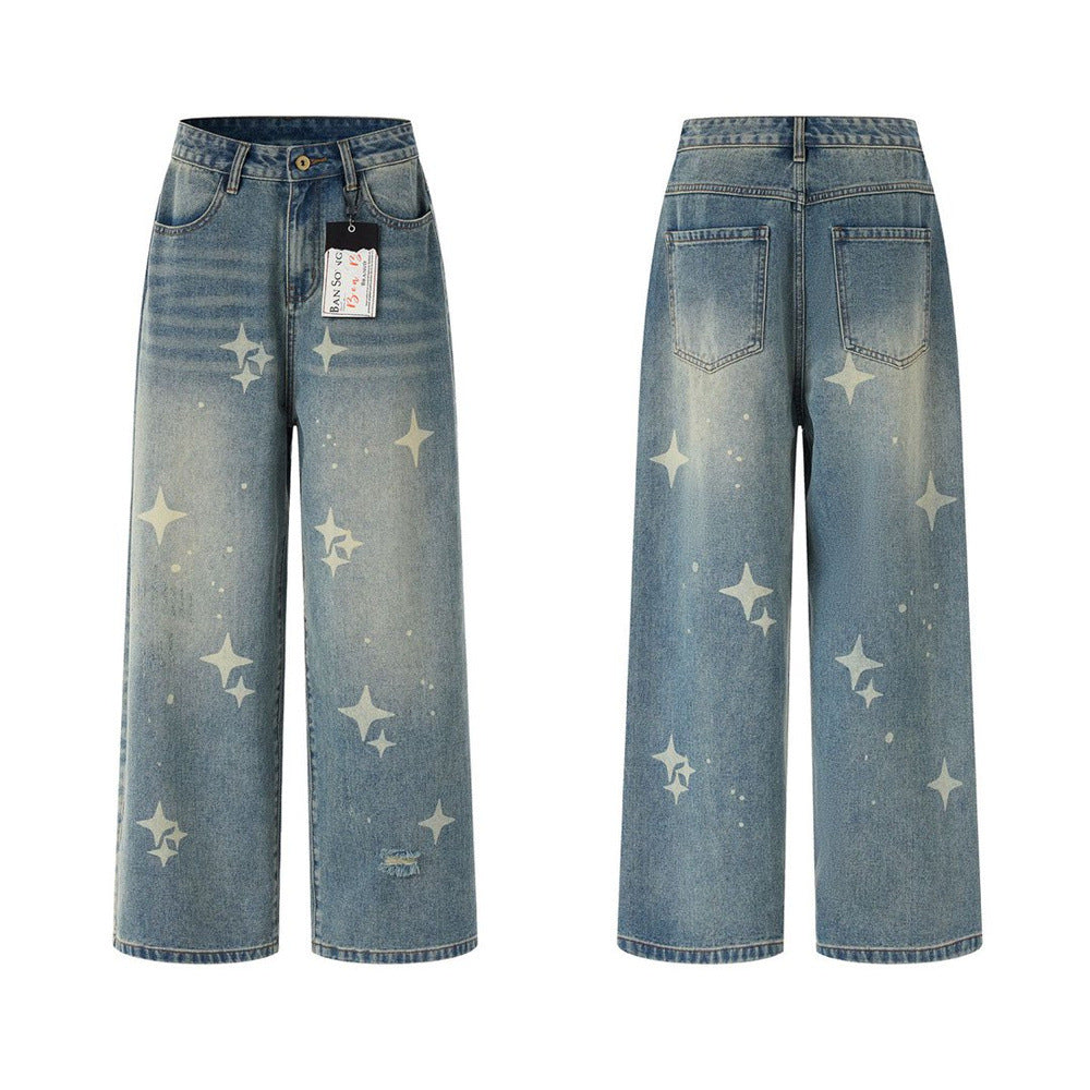 Men's baggy light blue wide-leg jeans with all-over four-point star print and vintage wash finish, front and back view