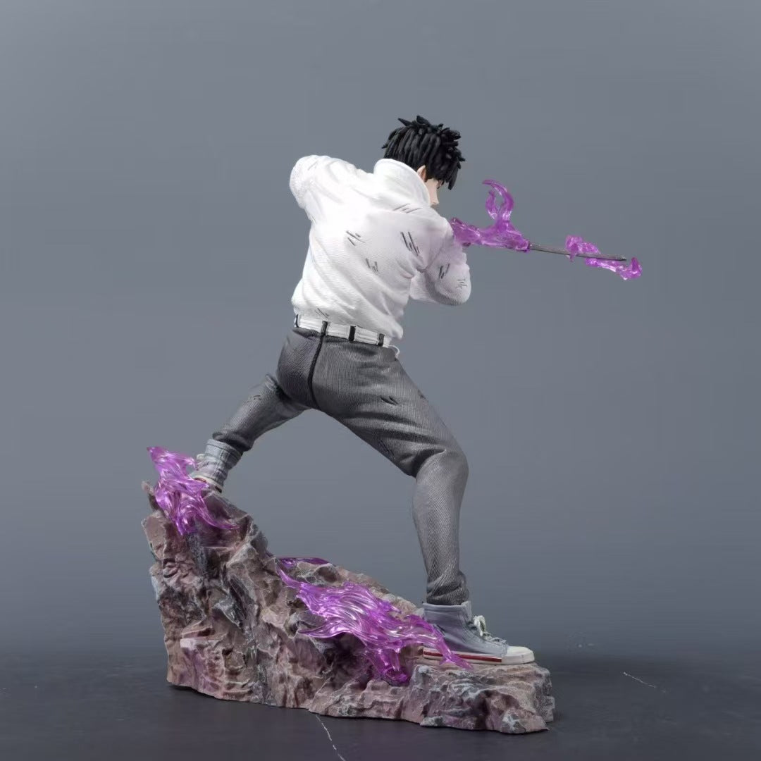 The Jujutsu Kaisen Yuta Okkotsu PVC Figure – 21 cm captures a dynamic battle pose, featuring Yuta with short black hair in a white shirt and gray pants atop a rocky base, wielding a cursed sword with vibrant purple energy against a plain gray backdrop.