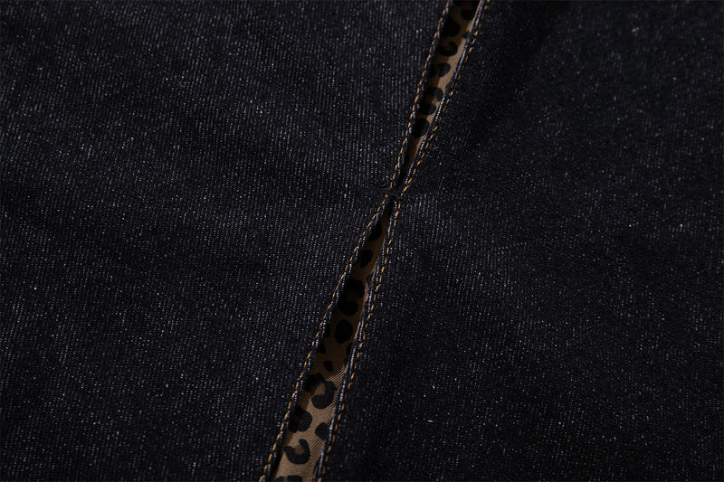 Vaqueros baggy negros con inserciones de estampado de leopardo y corte de pierna ancha