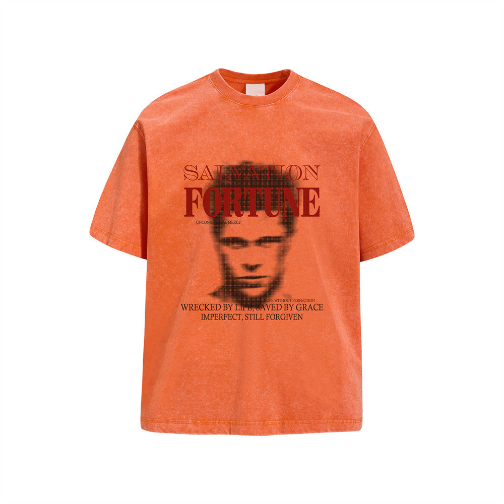 Oversized acid-wash graphic t-shirt with Salvation Fortune halftone portrait print in washed orange, blue, and grey colorways