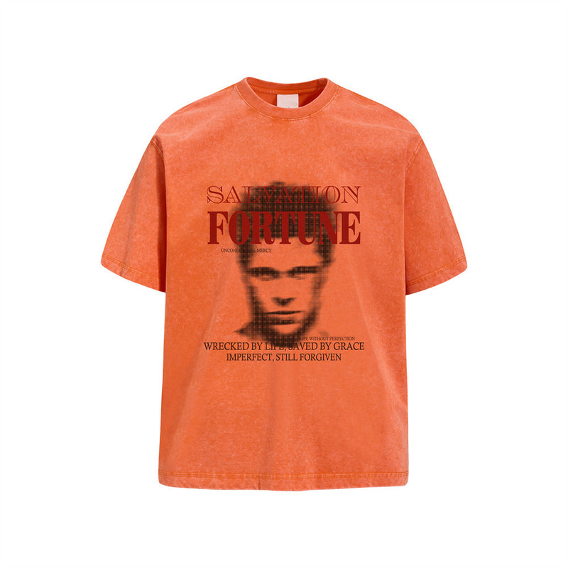 Oversized acid-wash graphic t-shirt with Salvation Fortune halftone portrait print in washed orange, blue, and grey colorways