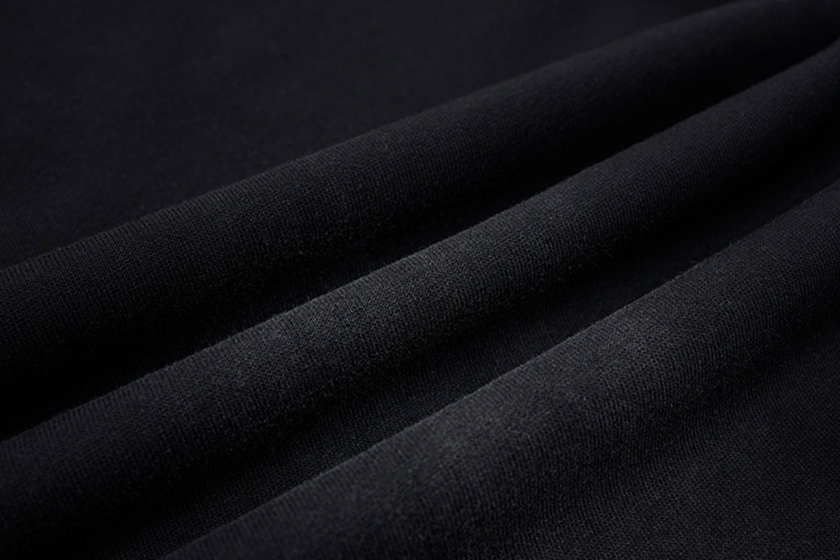 Pantalon de survêtement ample à jambes larges avec bandes latérales, fausse double ceinture et imprimé graphique