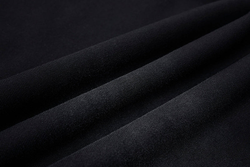 Pantalon de survêtement ample à jambes larges avec bandes latérales, fausse double ceinture et imprimé graphique