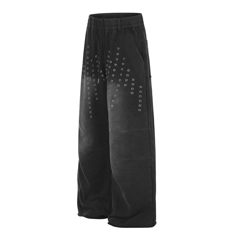 Pantalon de survêtement ample à œillets métalliques, finition délavée à l’acide & ourlet brut