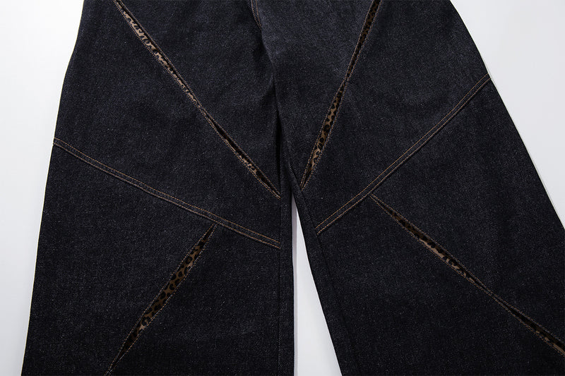 Vaqueros baggy negros con inserciones de estampado de leopardo y corte de pierna ancha