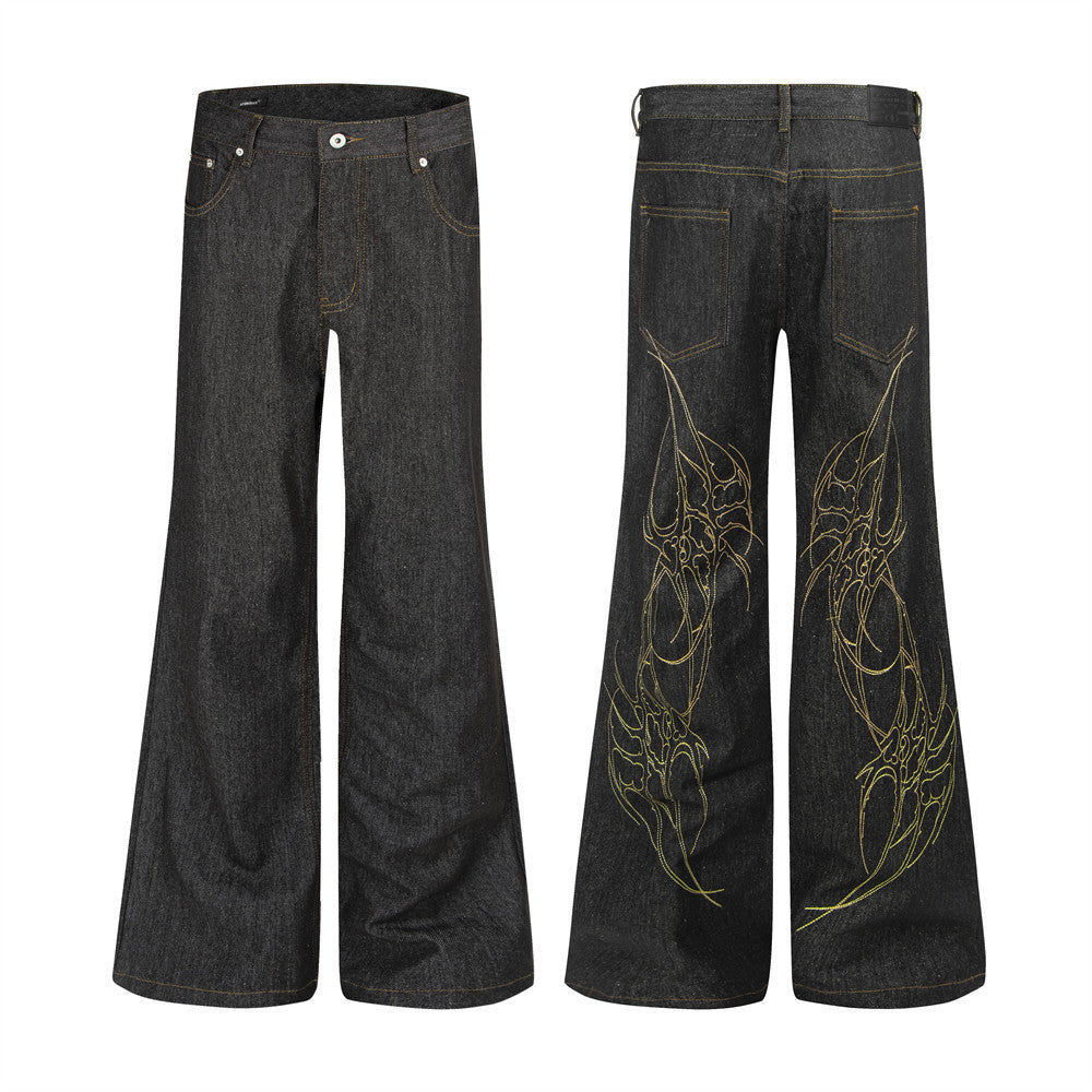 Raw black denim wide-leg flare jeans with gold tribal embroidery on back panels, front and back view