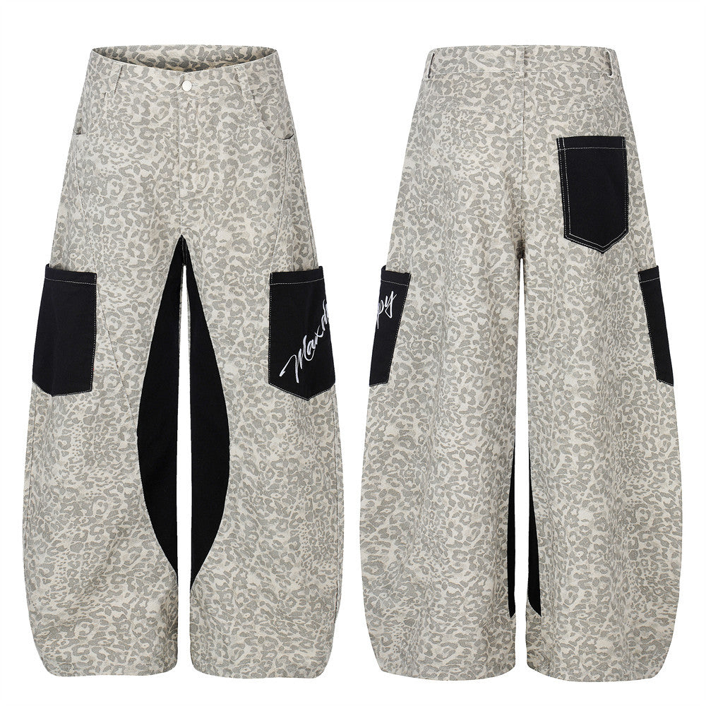 Men's grey leopard print wide-leg cargo jeans with black colorblock panels and script embroidery pocket detail