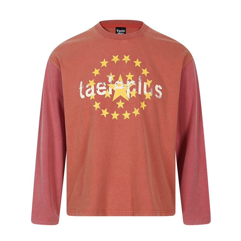 Taele Plus oversized long-sleeve tee with distressed yellow star circle graphic print in burnt orange vintage wash colorway
