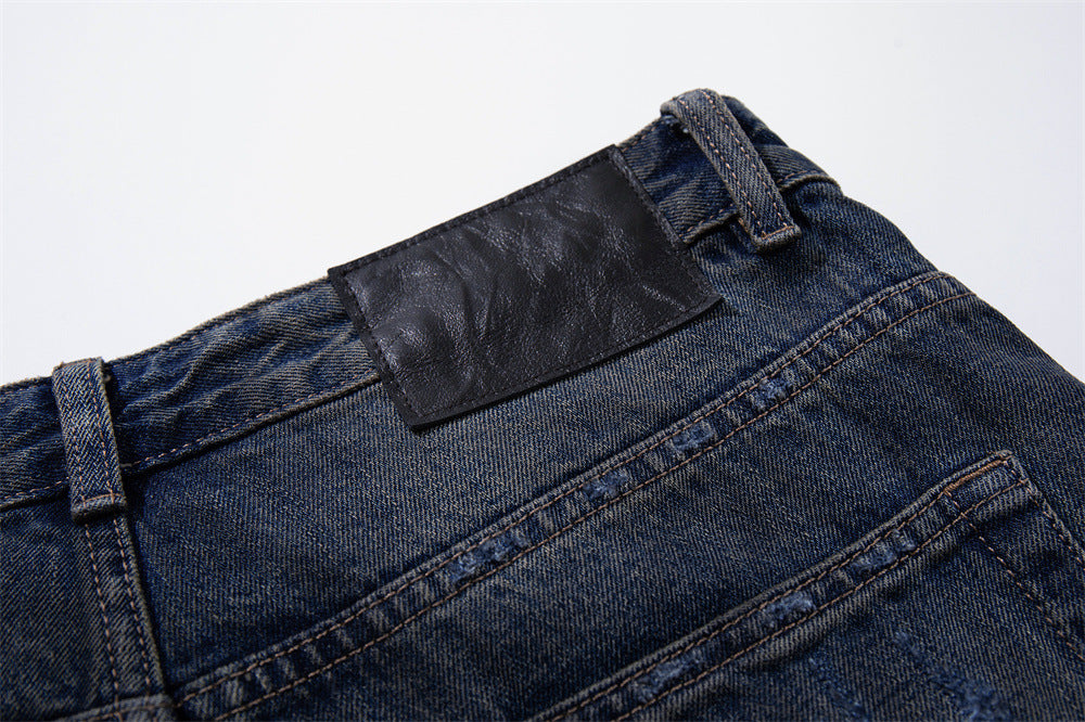 Wide-Leg Ripped Jeans – Vintage Washed Distressed Denim with Studded Patches