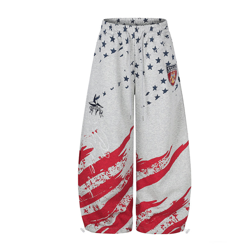 Oversized wide leg sweatpants in heathered grey with distressed red stripe and navy star American flag print, front and back