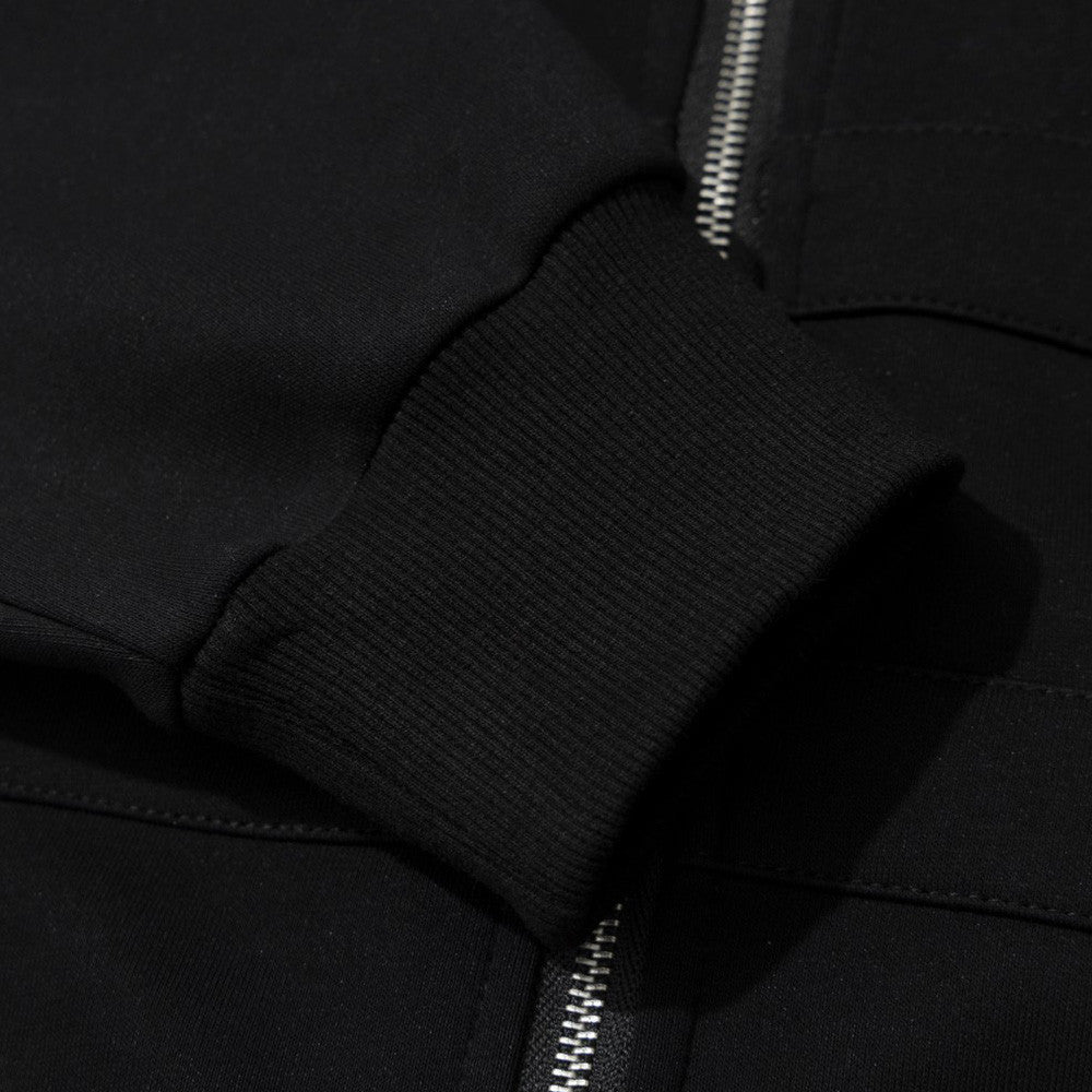 Sweat à capuche noir zippé avec col en fausse fourrure et détails cloutés métalliques