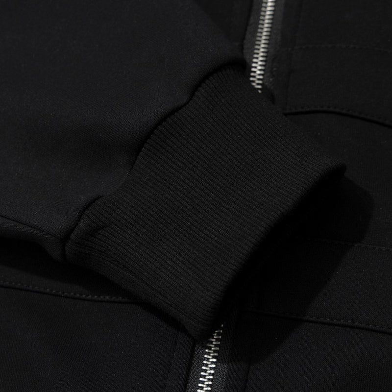 Sweat à capuche noir zippé avec col en fausse fourrure et détails cloutés métalliques