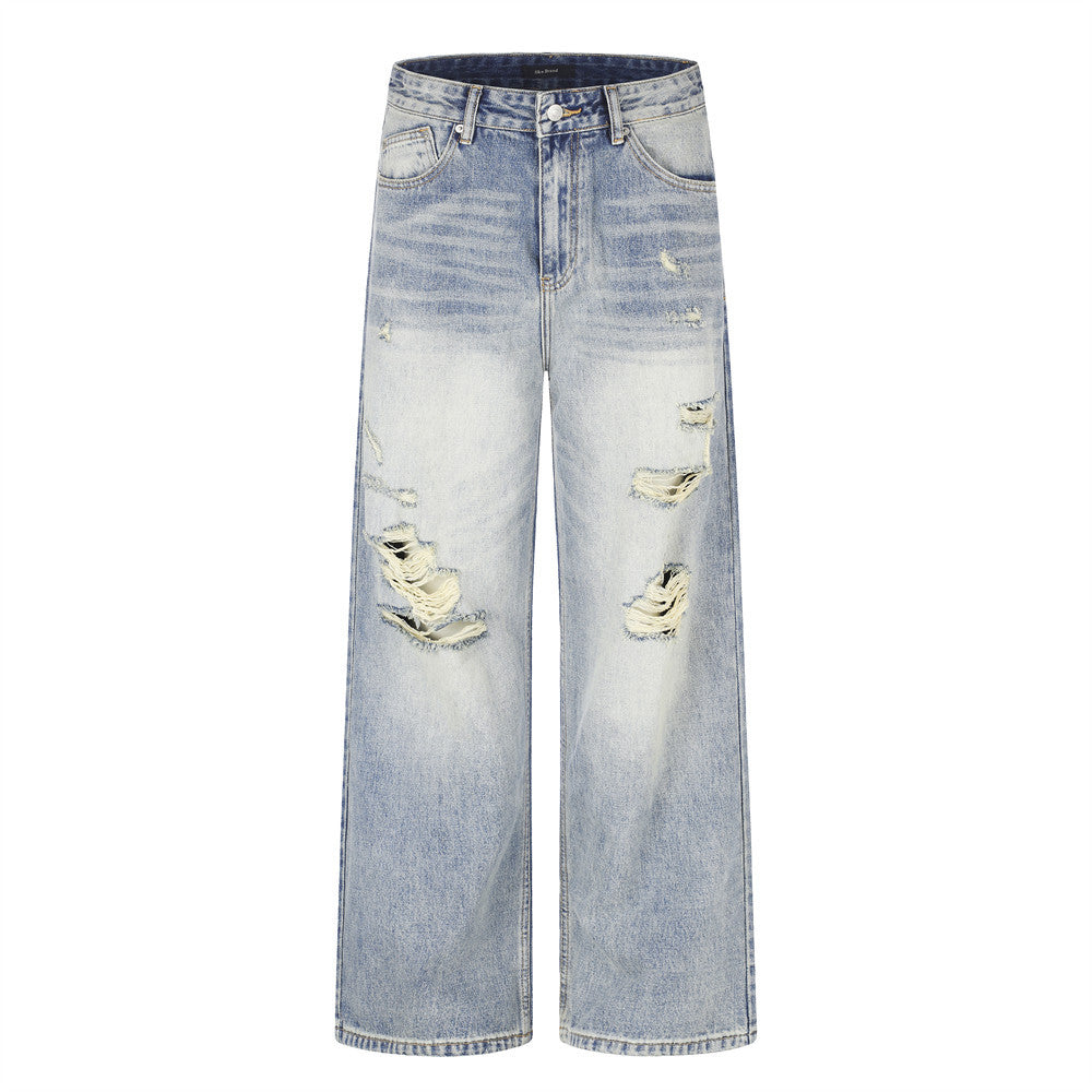 Men's wide-leg light wash distressed jeans with heavy rip detailing on the thighs and knees, front and back view
